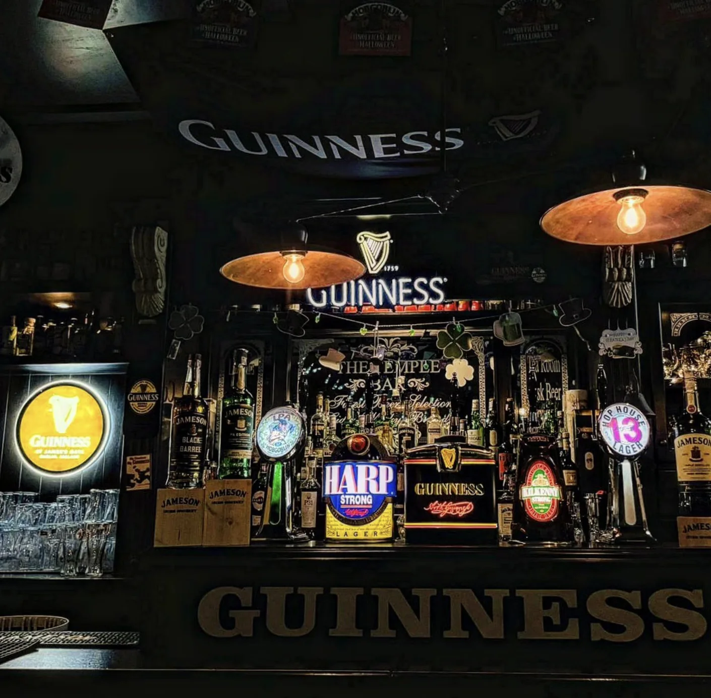 The Temple Bar counter and taps beneath the warm lights